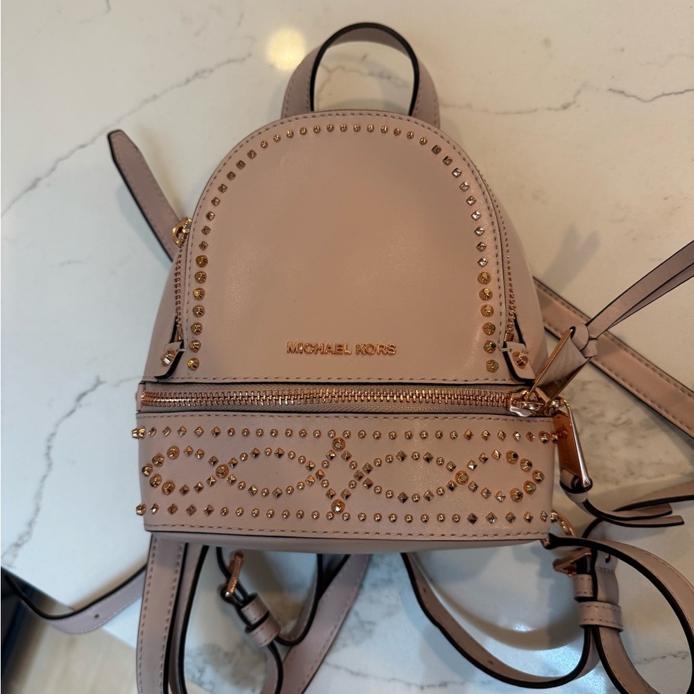Michael Kors Pink and Gold Backpack with Perforated Design